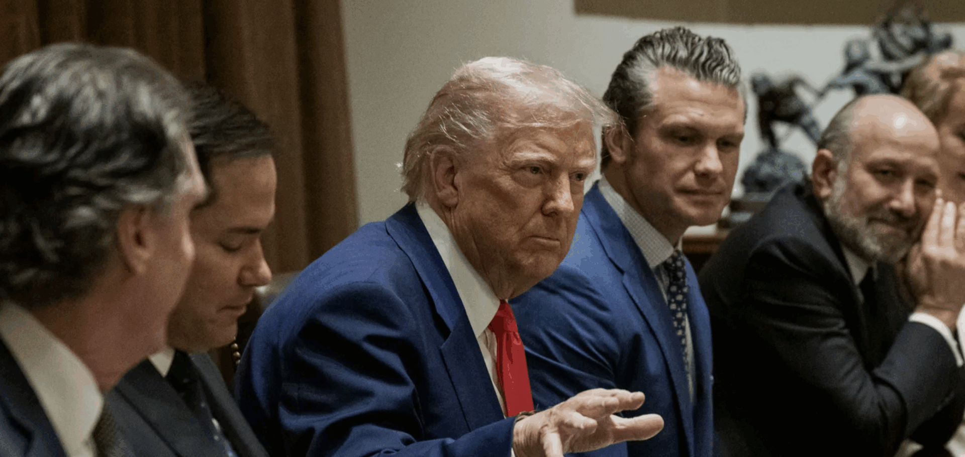 Group of men sitting at a table.